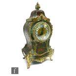 A French 19th Century Boulle work eight-day mantle clock, the gilt dial with white enamelled Roman