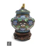 A Chinese cloisonné vase and cover of baluster form, decorated with ruyi borders, and polychrome