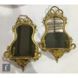 A pair of 19th Century gilt painted pine and gesso girandole wall brackets, each with a tied