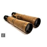 A pair of World War Two German tropical or field glasses, painted in khaki, stamped bmj 588681
