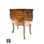 A 20th Century French walnut veneered bombe fronted chest of two drawers with gilt metal handles and