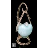 A late 19th Century small posy basket decorated in pale blue over opal with applied clear loop