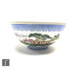 A Chinese eggshell porcelain bowl, the fine white porcelain picked out with blue ruyi border, and