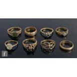 Eight assorted 9ct hallmarked rings to include two wedding rings and five set examples, total weight