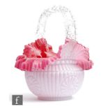 A late 19th Century glass posy basket, with pink over opal moulded ribbed and floral motif
