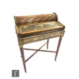 An early 20th Century French walnut and brass inlaid tambour top writing desk, opening to reveal a