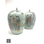A pair of Chinese famille rose jars and covers, each of ovoid form with flat covers and pointed
