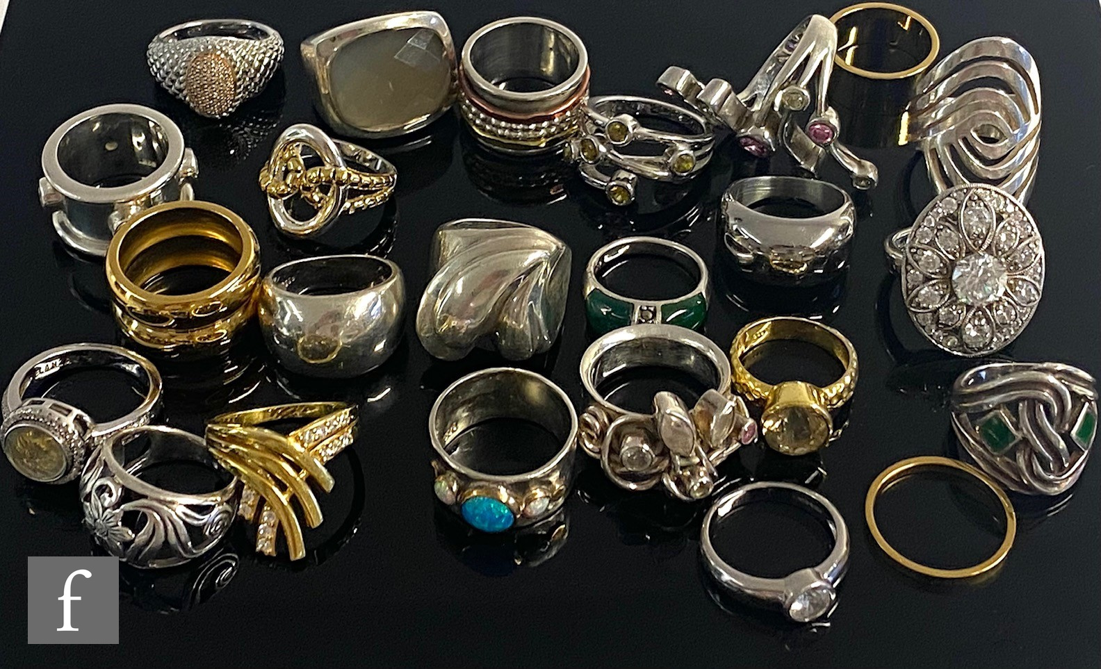 Twenty four assorted silver and white metal dress rings to include stones set and plain examples,