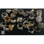 Twenty four assorted silver and white metal dress rings to include stones set and plain examples,