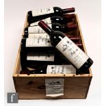 A case of twelve 75cl bottles of 1985 Château Pichecan, Margaux, France, Bordeux, in original wooden