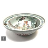 A Chinese famille rose bowl, late Qing Dynasty (1644-1912), of rounded form with rimmed edge, the