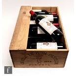 A case of twelve 75cl bottles of 1983 Chateau Le Bon Pasteur, Pomerol, France, in original crate.