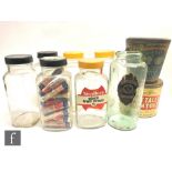 A collection of 1950s/60s confectionery glass jars, including three with Payne's, Croydon and Surrey