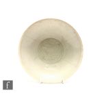 A Chinese Qingbai ware dish, late Northern Song or early Southern Song, of circular form with ribbed