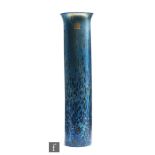 A large Isle of Wight vase of slender sleeve form with everted rim, decorated with petrol blue