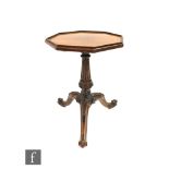 A Victorian octagonal mahogany wine table on tapering fluted pedestal and scroll tripod base,