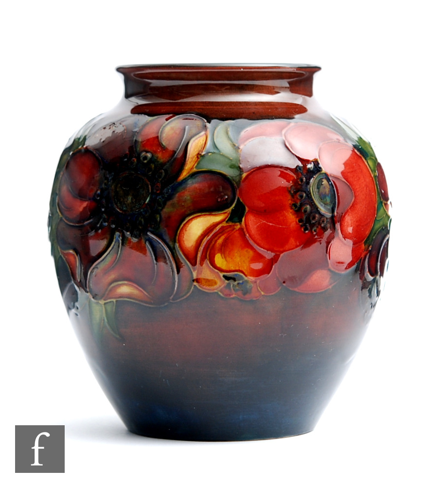 A Moorcroft vase of ovoid form with a flared neck decorated in the Flambe Anemone pattern, impressed