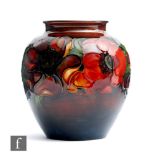 A Moorcroft vase of ovoid form with a flared neck decorated in the Flambe Anemone pattern, impressed