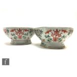 A pair of Chinese Tongzhi (1862-1874) famille rose pedestal bowls, each bowl rising from a splayed