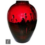 A large Royal Doulton Flambe vase of swollen form decorated with a silhouette scene of an Egyptian