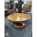 A 19th Century rosewood veneered tilt-top circular dining or breakfast table, the moulded edge top