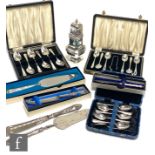 A small parcel lot of assorted hallmarked silver flat ware to include three cased sets of teaspoons,