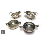 Four items of hallmarked silver, two sauce boats, a twin handled pedestal bowl and a similar