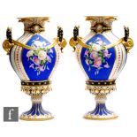 A pair of late 19th Century Carl Tielsch twin handled pedestal vases decorated with hand painted