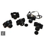 A collection of various SLR cameras, to include a Miranda MS-1N, a Miranda MS-2 Super, a Centon