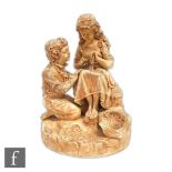 A 19th Century Robinson and Leadbetter Vellum range figure of a young girl sat mending a piece of