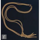 A 1970s 9ct hallmarked foxtail link double chain necklet terminating in four strand tassel detail,