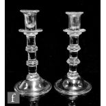 A pair of 19th Century clear crystal glass candlesticks in the 18th Century taste with upper