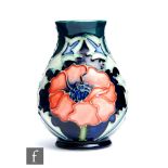 A small Moorcroft Pottery baluster vase decorated in the Poppy pattern designed by Rachel Bishop,