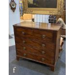 A George III style mahogany secretaire chest of four long cockbeaded drawers, the top drawer with