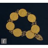A half sovereign bracelet comprising five Edward VII and two George V half sovereigns each united by