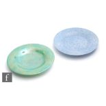 Two Ruskin Pottery shallow saucer dishes, the first in an apple green lustre, the second in a