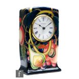 A Moorcroft Pottery mantel clock decorated in the Queens Choice pattern designed by Emma Bossons,