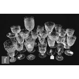 A collection of 19th Century and later drinking glasses to include acid etched, floral engraved, cut