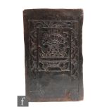 A small carved rectangular wooden panel, possibly from a coffer chest, carved with foliate urn