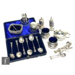A small parcel lot of assorted hallmarked silver items to include various condiments, napkin