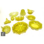 A collection of 19th Century Davidsons pressed Primrose Pearline glass to include posy vases,