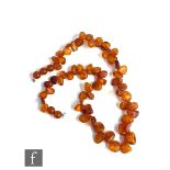 A single row of irregular cut and polished Baltic amber beads, weight 49g, length 56cm,