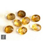 Eight loose cut and polished oval yellow citrine stones each approximately length 12mm, width
