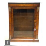 A Victorian walnut pier cabinet, the interior enclosed by a glazed door, with gilt metal mounts