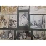 A collection of late 19th to early 20th Century portrait photographs, postcards and scrap books,