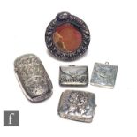 Four early 20th Century hallmarked items, a small photograph frame, two stamp cases and a vesta