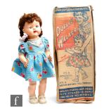A British National Doll Product Dollie Walker hard plastic doll, with original box.