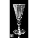 A 20th Century reproduction heavy baluster goblet in the early 18th Century taste, with a round