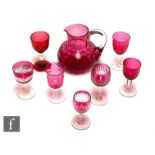 A collection of 19th Century and later drinking glasses in clear crystal and ruby with engraved,