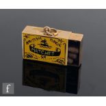 A 9ct hallmarked novelty charm modelled as a box of British Made matches with yellow and black